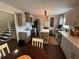 Updated kitchen with gray cabinets, stainless appliances, island, and tile backsplash at 3147 Pine Needle Sw Ct, Lilburn, GA 30047