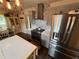 Bright, updated kitchen with an island, stainless appliances, and tiled backsplash at 3147 Pine Needle Sw Ct, Lilburn, GA 30047