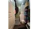 Functional laundry room with stacked washer/dryer and ample storage space at 3147 Pine Needle Sw Ct, Lilburn, GA 30047