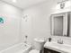 Bathroom with new fixtures including new vanity, mirror and light fixtures and tub at 8298 Holly Dr, Jonesboro, GA 30238