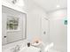 Charming bathroom features sleek fixtures, a large mirror, and a shower for a clean and bright experience at 8298 Holly Dr, Jonesboro, GA 30238