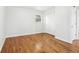 Clean bedroom featuring beautiful hardwood floors, neutral paint, and natural light at 8298 Holly Dr, Jonesboro, GA 30238