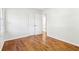 This bedroom offers hardwood floors, closet, and neutral paint for a clean and welcoming space at 8298 Holly Dr, Jonesboro, GA 30238