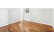 Inviting bedroom features hardwood floors, fresh paint, and an open layout to allow maximum sunlight at 8298 Holly Dr, Jonesboro, GA 30238