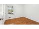 Hardwood floors and new windows in a well lit bedroom ready for furnishings at 8298 Holly Dr, Jonesboro, GA 30238