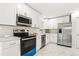 Stylish kitchen with stainless steel appliances and plenty of storage space at 8298 Holly Dr, Jonesboro, GA 30238