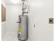 Newly installed water heater in utility area with fresh paint and clean flooring at 8298 Holly Dr, Jonesboro, GA 30238