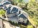 Beautiful home features an expansive driveway, professional landscaping, and a three car garage at 925 Sunny Meadows Ln, Marietta, GA 30062