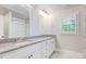 Bright bathroom featuring marble counters, large mirror and shower at 925 Sunny Meadows Ln, Marietta, GA 30062