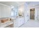 Luxurious bathroom with granite countertops, dual vanities, and a glass-enclosed shower for a spa-like experience at 925 Sunny Meadows Ln, Marietta, GA 30062