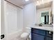 Compact bathroom featuring a combined shower and tub, complemented by a sleek vanity at 925 Sunny Meadows Ln, Marietta, GA 30062
