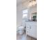 Bathroom with white vanity, granite countertop, and window with natural light at 925 Sunny Meadows Ln, Marietta, GA 30062
