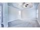 Spacious bedroom with tray ceilings, carpeting, shutters, and walk-in closet at 925 Sunny Meadows Ln, Marietta, GA 30062
