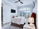 Well-lit bedroom featuring a large window, contemporary furnishings, and a soothing color palette at 925 Sunny Meadows Ln, Marietta, GA 30062