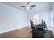 Bedroom area with hardwood floors, ceiling fan, and base trim at 925 Sunny Meadows Ln, Marietta, GA 30062