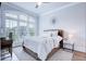 Bright bedroom with a large window, complemented by a cozy rug and a comfortable bed setting at 925 Sunny Meadows Ln, Marietta, GA 30062