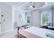 Bright bedroom featuring a bed, dresser, plush rug, and large windows for natural light at 925 Sunny Meadows Ln, Marietta, GA 30062