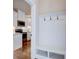 Mudroom space with built-in bench and coat hooks, adjacent to a kitchen at 925 Sunny Meadows Ln, Marietta, GA 30062