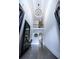 Grand foyer with soaring ceilings, chandelier, and hardwood floors creating an impressive entrance at 925 Sunny Meadows Ln, Marietta, GA 30062