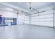 Spacious three car garage with bright lighting and epoxy flooring at 925 Sunny Meadows Ln, Marietta, GA 30062