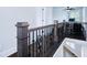 Hallway with dark wood railing overlooking office with computer station at 925 Sunny Meadows Ln, Marietta, GA 30062