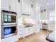 This gourmet kitchen features stainless steel appliances, a gas range, and custom white cabinetry at 925 Sunny Meadows Ln, Marietta, GA 30062