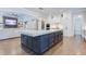 Modern kitchen with a spacious center island, stainless appliances, and open access to the living area at 925 Sunny Meadows Ln, Marietta, GA 30062