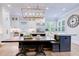 Well-lit kitchen features custom cabinets, stainless steel appliances, and a spacious island with seating at 925 Sunny Meadows Ln, Marietta, GA 30062