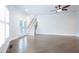 Bright living room with hardwood floors, staircase and French doors at 925 Sunny Meadows Ln, Marietta, GA 30062