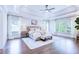 Serene main bedroom with tray ceilings, hardwood floors, and ample natural light creating a relaxing retreat at 925 Sunny Meadows Ln, Marietta, GA 30062