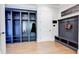 Mudroom with built-in storage, bench, coat hooks, and hardwood floors at 925 Sunny Meadows Ln, Marietta, GA 30062