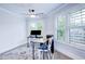 Bright office features a ceiling fan, natural light from shuttered windows, and elegant decor at 925 Sunny Meadows Ln, Marietta, GA 30062
