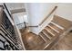 Elegant staircase with hardwood steps, decorative iron railing, and natural light at 925 Sunny Meadows Ln, Marietta, GA 30062