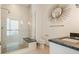 Contemporary bathroom showcasing a glass enclosed shower with a shower bench and granite countertop sink at 1065 Peachtree Ne St # 2803, Atlanta, GA 30309