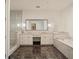 Elegant bathroom featuring double sinks, marble floors, and a glass-enclosed shower at 1065 Peachtree Ne St # 2803, Atlanta, GA 30309