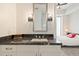 Bathroom featuring dark countertops, modern lights, and an open view to a spacious bedroom at 1065 Peachtree Ne St # 2803, Atlanta, GA 30309