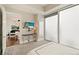 Well-lit bedroom featuring floor to ceiling windows and an open view to the dining room and living room at 1065 Peachtree Ne St # 2803, Atlanta, GA 30309