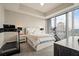 Cozy bedroom with large windows, plush carpet, and city views, perfect for relaxation at 1065 Peachtree Ne St # 2803, Atlanta, GA 30309