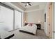 Bright bedroom with floor to ceiling windows and tray ceiling, carpeted floor, and ceiling fan at 1065 Peachtree Ne St # 2803, Atlanta, GA 30309