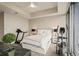 Comfortable bedroom with cityscape views and modern exercise equipment at 1065 Peachtree Ne St # 2803, Atlanta, GA 30309
