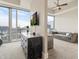 Well-lit bedroom featuring a city view, large tv, and workspace at 1065 Peachtree Ne St # 2803, Atlanta, GA 30309