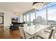 Modern dining room with city views, hardwood flooring, fireplace, and elegant decor at 1065 Peachtree Ne St # 2803, Atlanta, GA 30309