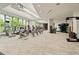 A well-equipped gym with treadmills, elliptical machines, and ample natural light at 1065 Peachtree Ne St # 2803, Atlanta, GA 30309