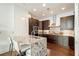 Modern kitchen featuring stainless steel appliances, granite counters, and hardwood floors at 1065 Peachtree Ne St # 2803, Atlanta, GA 30309
