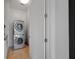Convenient laundry room featuring a stacked washer and dryer unit, optimizing space and functionality at 1065 Peachtree Ne St # 2803, Atlanta, GA 30309