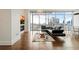 Living room featuring floor-to-ceiling windows, a modern fireplace, and city views at 1065 Peachtree Ne St # 2803, Atlanta, GA 30309