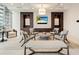 Comfortable lounge area featuring stylish seating, a large screen television, and modern décor at 1065 Peachtree Ne St # 2803, Atlanta, GA 30309