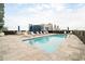Relaxing rooftop pool area with lounge chairs and umbrellas overlooking the city skyline at 1065 Peachtree Ne St # 2803, Atlanta, GA 30309