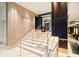 Elegant staircase with marble steps, stainless steel railings, and modern design elements at 1065 Peachtree Ne St # 2803, Atlanta, GA 30309