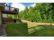 Manicured backyard with green grass and privacy fence adjacent to the deck at 4568 Mantova Dr, Buford, GA 30519
